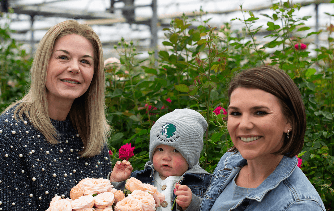 April & Ashley with child and roses